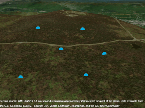Six blue markers plotted over satellite imagery and terrain