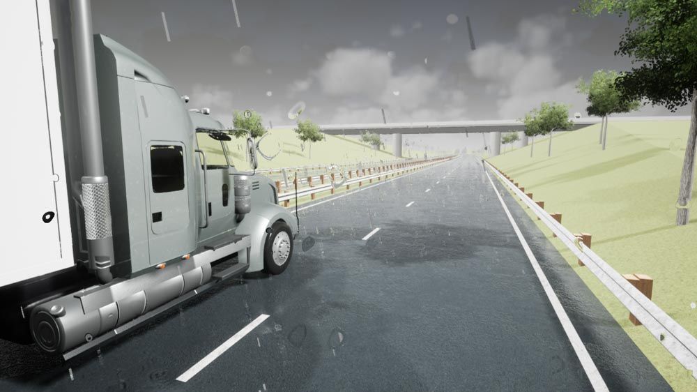Representación fotorrealista de un camión gris que circula por una autopista bajo la lluvia, con charcos en la carretera y gotas de lluvia en la lente de la cámara.
