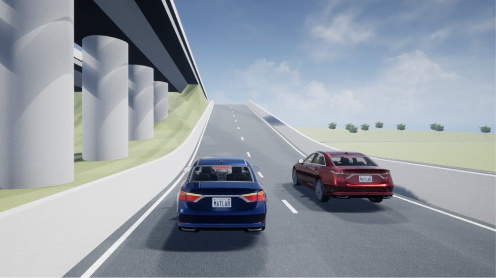   Representación fotorrealista de un automóvil azul por un acceso a autopista de dos carriles, con otro automóvil rojo en el carril de la derecha.
